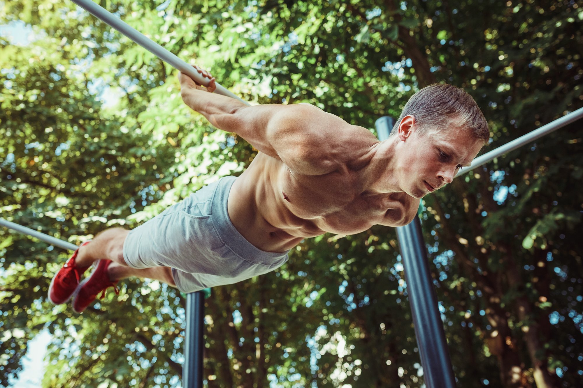 athlete-doing-exercises-stadium-park