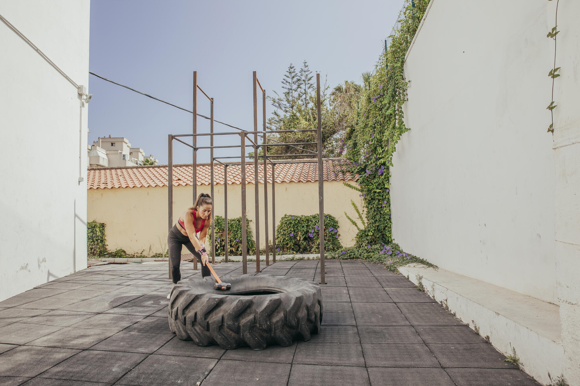 woman-doing-crossfit-with-hammer-wheel